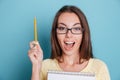 Close-up portrait of a beautiful excited woman in eyeglasses