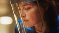 Close Up Portrait of Beautiful Female Fabricator in Safety Mask. She is Grinding a Metal Object. E