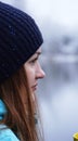 Close up portrait of a beautiful girl dreaming looking into the distance standing outdoor with cup of tea. Royalty Free Stock Photo