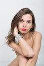 Close-up portrait of a beautiful girl with red lips, brilliant bracelet on the wrist. Red Lips and Nails closeup