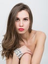 Close-up portrait of a beautiful girl with red lips, brilliant bracelet on the wrist. Red Lips and Nails closeup