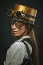 Close-up portrait of a beautiful girl steampunk, hat and eyecup.