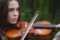 Close up portrait of a beautiful girl violinist who plays the violin romantic work Royalty Free Stock Photo
