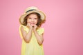 Close up portrait of a Beautiful girl in yellow dress and straw hat. Royalty Free Stock Photo