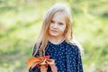 Close up portrait of beautiful little girl with blonde long hair and big blue eyes Royalty Free Stock Photo