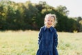 Close up portrait of beautiful little girl with blonde long hair and big blue eyes Royalty Free Stock Photo