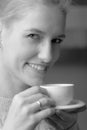 Close-up portrait of a beautiful mid age woman with cup of coffee Royalty Free Stock Photo