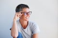 Close up beautiful older woman smiling with glasses against white background Royalty Free Stock Photo