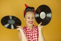 Close up portrait beautiful pin up girl with old vinil records Royalty Free Stock Photo