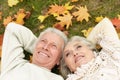 Portrait of beautiful senior couple lying on grass Royalty Free Stock Photo