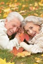 Portrait of beautiful senior couple lying on grass Royalty Free Stock Photo