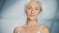 Close-up Portrait of Beautiful Senior Woman Looking at Camera and Smiling Wonderfully. Elderly Bea Royalty Free Stock Photo