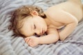 Close-up portrait of a beautiful sleeping baby. Cute infant kid. Child portrait in pastel tones. The baby could be a boy or girl Royalty Free Stock Photo