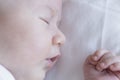 close up portrait of a beautiful baby on white background at home