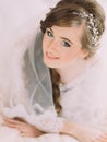 Close-up portrait of beautiful smiling bride with shining decoration in long curly hair Royalty Free Stock Photo