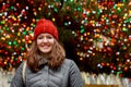 Close up portrait of a beautiful smiling girl with brown hair colorful lights bokeh Royalty Free Stock Photo