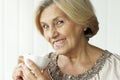 Portrait of beautiful smiling senior woman drinking tea Royalty Free Stock Photo