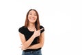 Close-up portrait of beautiful smiling young asian woman pointing with finger, looking at camera Royalty Free Stock Photo