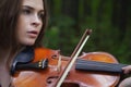 A close up portrait of a beautiful violinist girl Royalty Free Stock Photo
