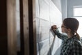 Close-up portrait of beautiful woman concentrated on work. Architect working in office with blueprints. Engineer Royalty Free Stock Photo