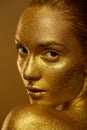 Close up portrait beautiful woman golden skin sparkles glitter Royalty Free Stock Photo