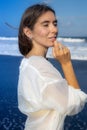 Close up portrait of beautiful woman with jewelry. Caucasian woman at the beach. Beauty and fashion concept. Romantic mood Royalty Free Stock Photo