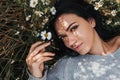 Close-up portrait of a beautiful woman on meadow looking to the camera and enjoying nature spring evening outdoors. Caucasian Royalty Free Stock Photo