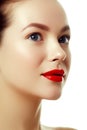 Beautiful woman`s purity face with bright red lip makeup Royalty Free Stock Photo