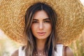 Close up portrait of a beautiful woman in straw hat