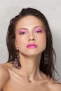 Close-up portrait of beautiful woman& x27;s purity face with pink make-up. Royalty Free Stock Photo