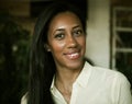 Close up portrait of a beautiful young african american woman smiling. Royalty Free Stock Photo