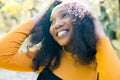 Close up portrait of a beautiful young african american woman smiling and looking up Royalty Free Stock Photo