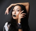 Close up portrait of Beautiful young asian female model with black lips and long hair Royalty Free Stock Photo