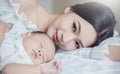 Close up portrait of beautiful young asian mother with her newborn baby. Royalty Free Stock Photo
