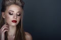 Close up portrait of beautiful young blond model with perfect provocative make up and stylish hairstyle Royalty Free Stock Photo