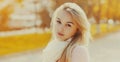 Close up portrait beautiful young blonde woman in autumn park Royalty Free Stock Photo