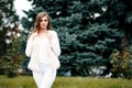 Close-up portrait of a beautiful young confident girl or business woman in a white suit with a beautiful make-up and hairdress on Royalty Free Stock Photo