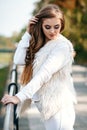 Close-up portrait of a beautiful young confident girl or businesswoman in a white suit with a beautiful make-up and hairdo on Royalty Free Stock Photo