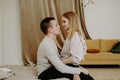 Close-up portrait of a beautiful young couple hugs in bed at home Royalty Free Stock Photo