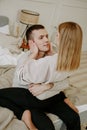 Close-up portrait of a beautiful young couple hugs in bed at home Royalty Free Stock Photo