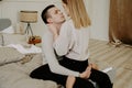 Close-up portrait of a beautiful young couple hugs in bed at home Royalty Free Stock Photo