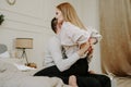 Close-up portrait of a beautiful young couple hugs in bed at home Royalty Free Stock Photo