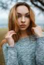 Close-up portrait of a beautiful young girl in stylish winter sw Royalty Free Stock Photo