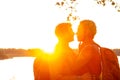 Close up portrait of a beautiful young interracial lesbian or gay couple waiting to kiss passionately in their traveling