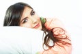 Close up portrait of beautiful young woman in bed. Smiling dre Royalty Free Stock Photo