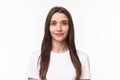 Close-up portrait of beautiful young woman, modern girl with long chestnut hair and no pimples, standing simple shirt Royalty Free Stock Photo