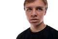 Close-up portrait of a blond 16 year old teenage boy against a background with copy space Royalty Free Stock Photo
