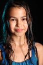 Dark-haired brown-eyed teenage girl posing in a black aqua-zone.