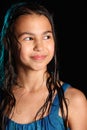 Dark-haired brown-eyed teenage girl posing in a black aqua-zone.