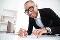Close-up portrait of a businessman making notes at documents Royalty Free Stock Photo